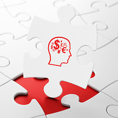 Image showing Marketing concept: Head With Finance Symbol on puzzle background