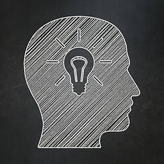 Image showing Marketing concept: Head With Light Bulb on chalkboard background