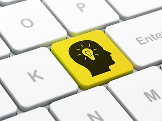 Image showing Finance concept: Head With Light Bulb on keyboard background