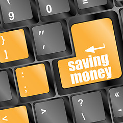 Image showing save money for investment concept with a blue button on computer keyboard