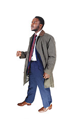 Image showing Man in coat walking.