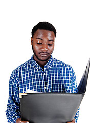 Image showing Black man reading paper.