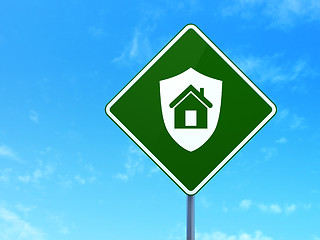 Image showing Business concept: Shield on road sign background