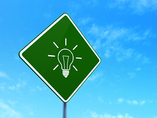 Image showing Business concept: Light Bulb on road sign background