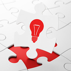 Image showing Business concept: Light Bulb on puzzle background