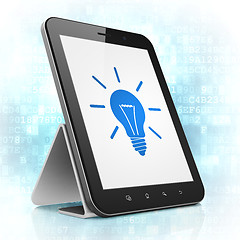 Image showing Finance concept: Light Bulb on tablet pc computer