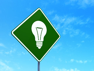 Image showing Finance concept: Light Bulb on road sign background