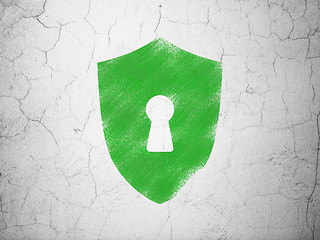 Image showing Privacy concept: Shield With Keyhole on wall background