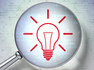 Image showing Finance concept:  Light Bulb with optical glass on digital