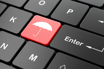 Image showing Security concept: Umbrella on computer keyboard background