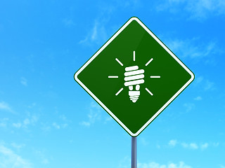 Image showing Business concept: Energy Saving Lamp on road sign background