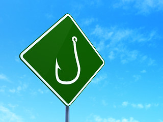 Image showing Protection concept: Fishing Hook on road sign background