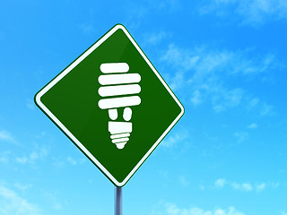 Image showing Business concept: Energy Saving Lamp on road sign background