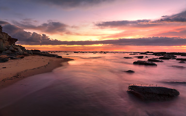 Image showing Magnificent sunrise high tide at Bateau Bay rockshelf