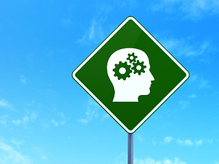 Image showing Finance concept: Head With Gears on road sign background