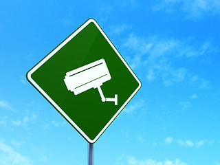 Image showing Protection concept: Cctv Camera on road sign background