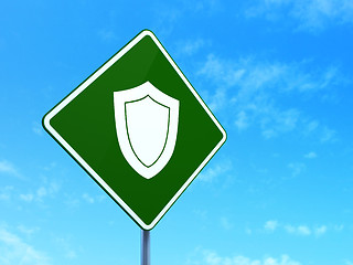 Image showing Security concept: Shield on road sign background
