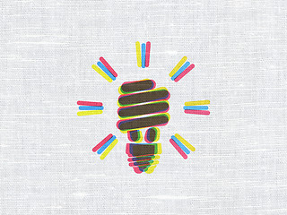 Image showing Business concept: Energy Saving Lamp on fabric texture