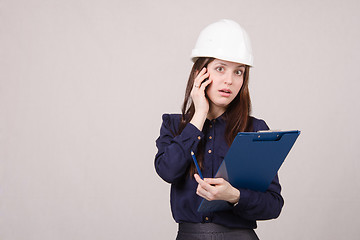 Image showing young girl is shocked by what he heard on phone