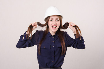 Image showing young girl a helmet in shock