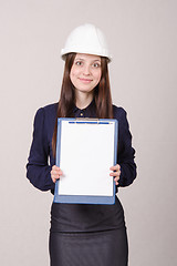 Image showing Beautiful girl helmet with a folder in hands