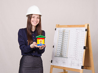 Image showing Girl gives a presentation of the new multi-storey building