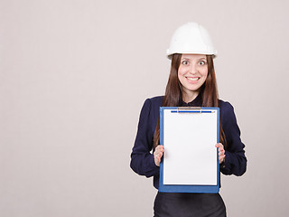 Image showing Girl a helmet in shock from inscription on sheet folder