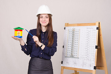 Image showing Girl gives a presentation of the new multi-storey building