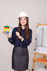 Image showing Girl advertises a new multi-storey building