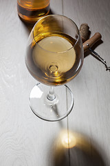 Image showing Glass of white wine on wooden table