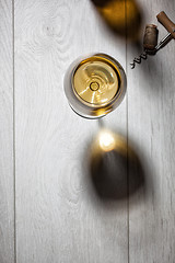 Image showing Glass of white wine on wooden table