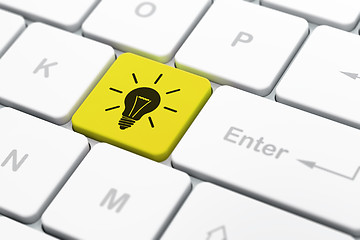 Image showing Finance concept: Light Bulb on computer keyboard background