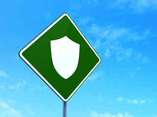 Image showing Protection concept: Shield on road sign background