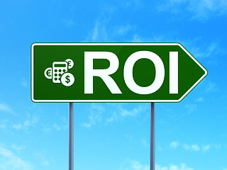 Image showing Business concept: ROI and Calculator on road sign background