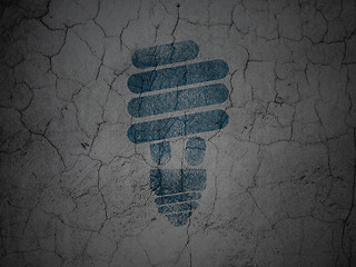 Image showing Finance concept: Energy Saving Lamp on grunge wall background