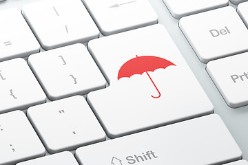 Image showing Security concept: Umbrella on computer keyboard background