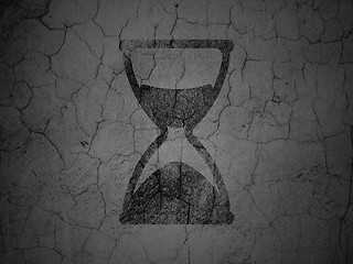 Image showing Time concept: Hourglass on grunge wall background