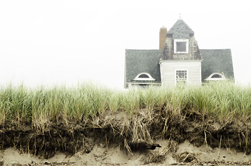 Image showing Foggy beach house landscape