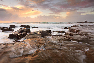 Image showing Ocean surf and overflows at sunrise