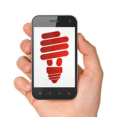 Image showing Finance concept: Energy Saving Lamp on smartphone