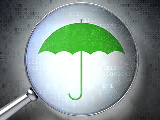 Image showing Safety concept:  Umbrella with optical glass on digital backgrou