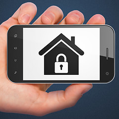 Image showing Protection concept: Home on smartphone