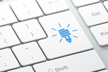 Image showing Finance concept: Energy Saving Lamp on computer keyboard backgro