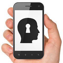 Image showing Advertising concept: Head With Keyhole on smartphone