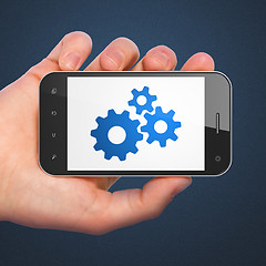 Image showing Web development concept: Gears on smartphone