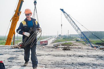 Image showing Worker on construction of bridge