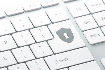 Image showing Privacy concept: Shield With Keyhole on computer keyboard backgr