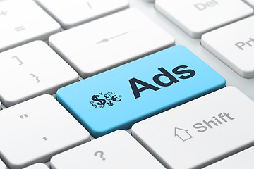 Image showing Advertising concept: Finance Symbol and Ads on computer keyboard