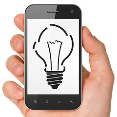 Image showing Finance concept: Light Bulb on smartphone