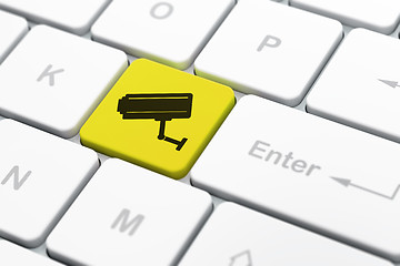 Image showing Safety concept: Cctv Camera on computer keyboard background